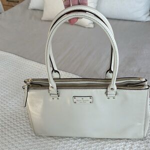 Kate Spade Cream Colored Leather shoulder bag with three zipper pockets